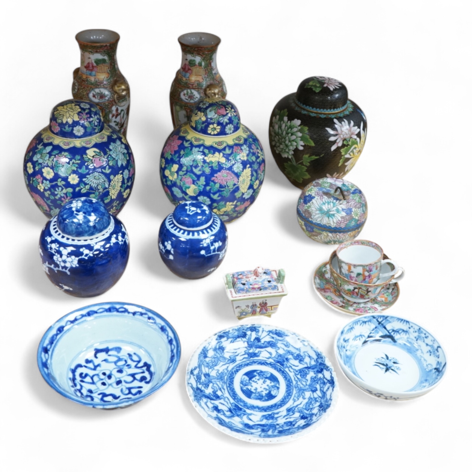 Fourteen pieces of Chinese porcelain and pottery, 19th/20th century to include a pair of blue and white ginger jars, famille rose cup and saucer and a cloisonné pot and cover in the form of an apple, largest 27cm high